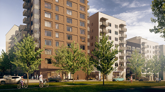 Vy utmed Häsovägen i Flemingsberg. Kvarteret består av byggnader i varierad höjd och material, med butiker i bottenvåningen vilket ger gatan en tydlig och innehållsrik stadskaraktär. 