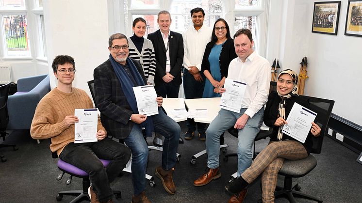 Members of staff from the Department of Architecture and Built Environment at Northumbria University celebrate the Surveying programmes retaining RICS accreditation.