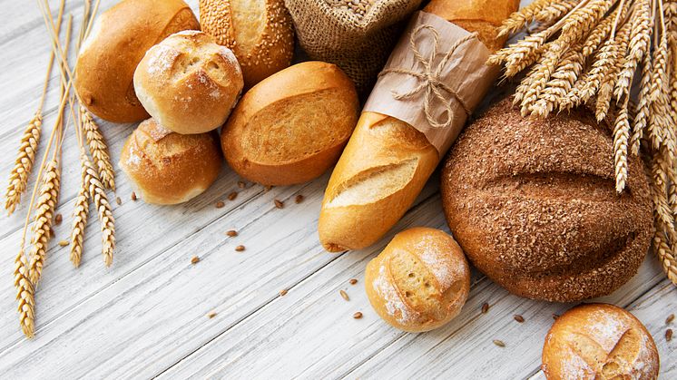 assortment of baked bread on white wooden background_ 8343 x 5283 px.jpg