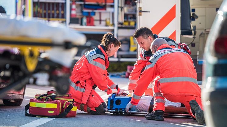 Stock image of paramedics responding to an emergency incident