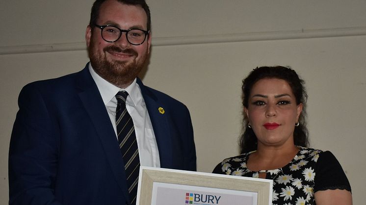 Councillor Eamonn O'Brien, the Leader of Bury Council presents the Adult Learner of the year award to Sara Saeedi