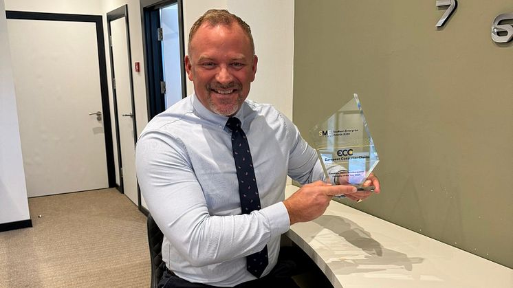 ECC's UK Head of Development Robert Dennis proudly displays SME award