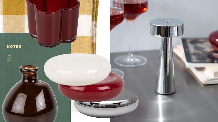 Stilren inredningsbild med moderna designföremål i krom, glas och keramik. Bilden visar ett arrangemang av skulpturala objekt