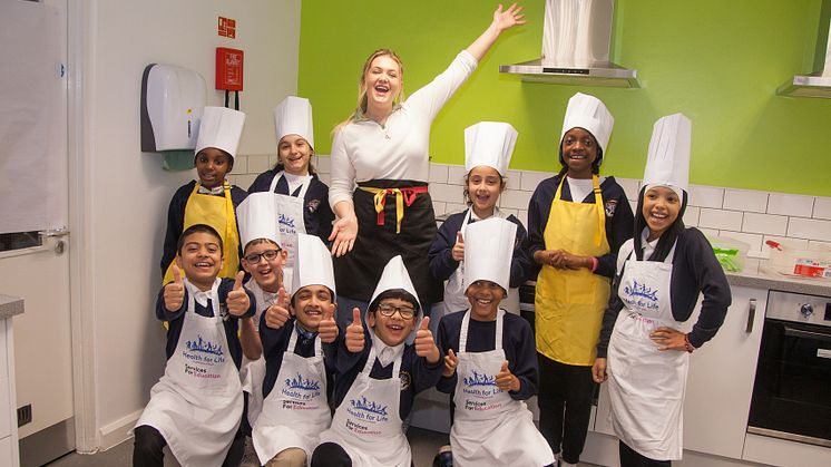 Pupils from Manor Park Primary with the Potato Queen, Poppy Cooks