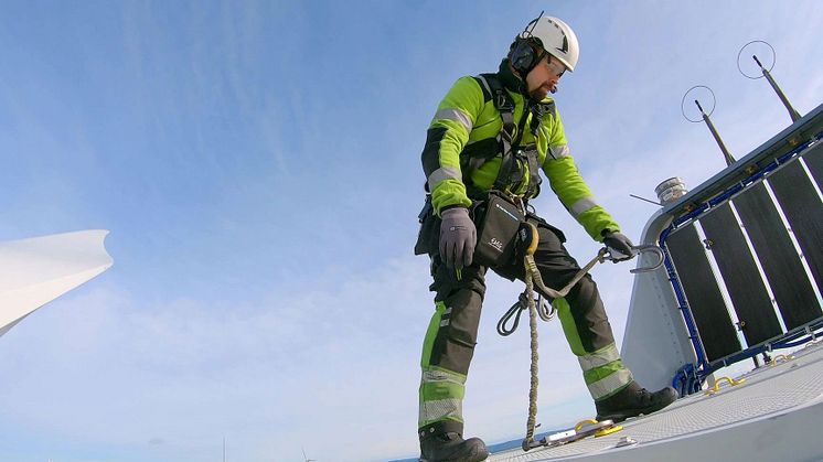 Operative undertaking maintenance on wind turbine