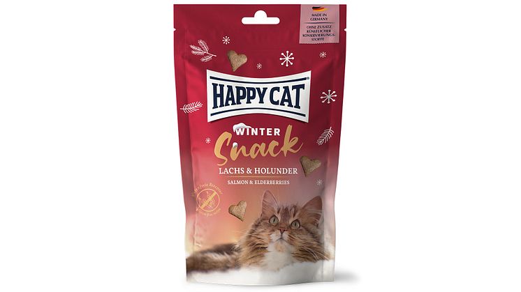 Die Happy Cat Winter Snacks in ihrer roten Packung sind ein ideales Präsent für Samtpfoten und Katzenbesitzer:innen
