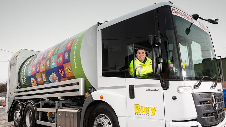 Cllr Alan Quinn with a bin wagon.