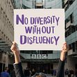 Hands holding up a placard saying No Diversity Without Disfluency