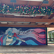 Kommunens sommarkonstnärer har fått i uppdrag av Huge att förnya utseendet på scenen i Huddinge centrum.