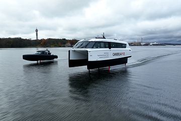 Candela's revolutionary electric C-8 leisure boat and P-12 ferry flying side by side, in Stockholm.
