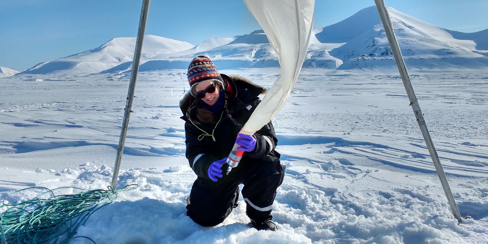 Eva Leu sampling under ice (Photo: Tom Brown)