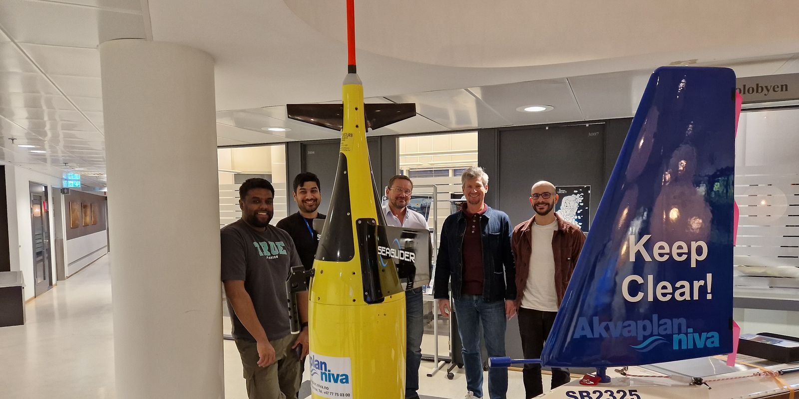 Pedersen gets an introduction to our autonomous platforms and ocean data sensors (Photo: Trude Borch/Akvaplan-niva)