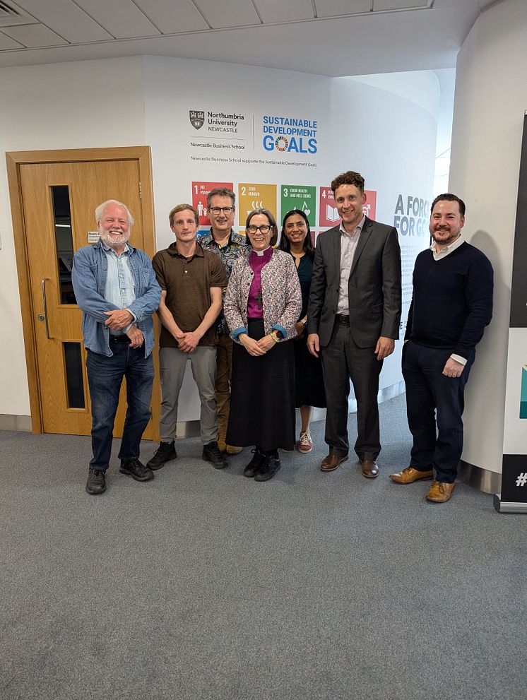 Group photo of experts who convened for a roundtable discussion on the social economy. 