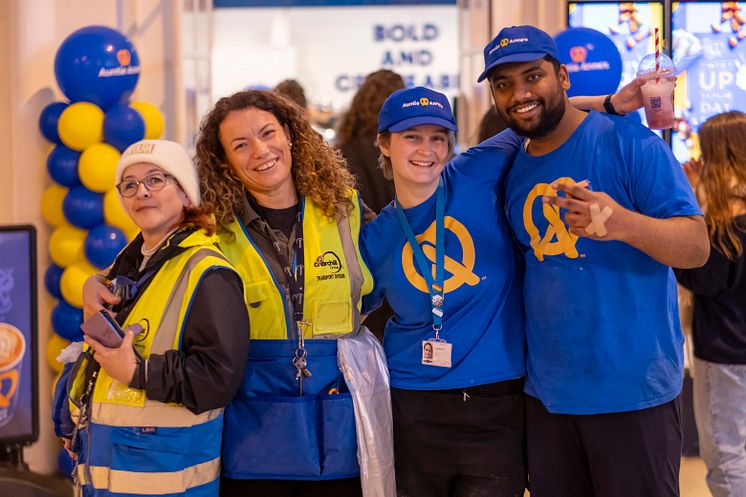 Auntie Anne's colleagues celebrate the store's opening event at Brighton station