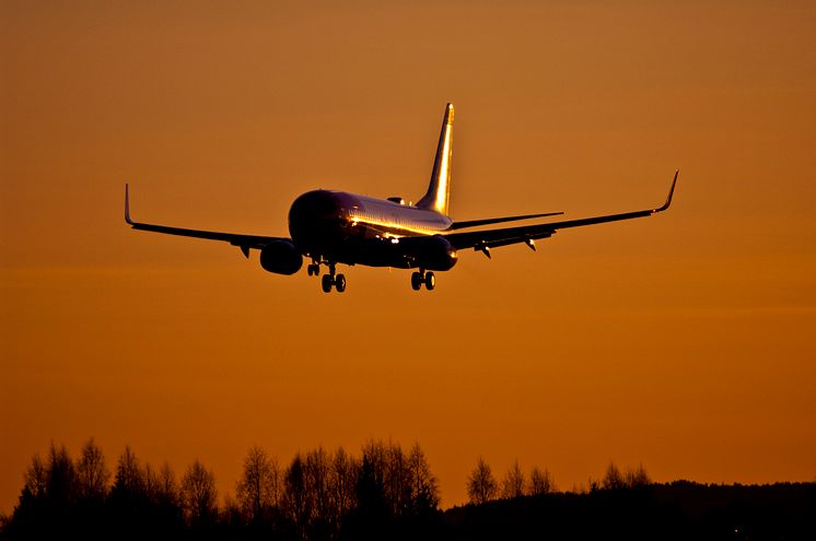 Norwegian aircraft at sunset