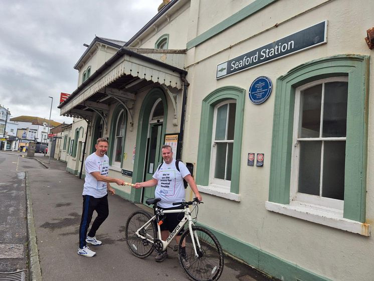 Station relay race swap over point at Seaford