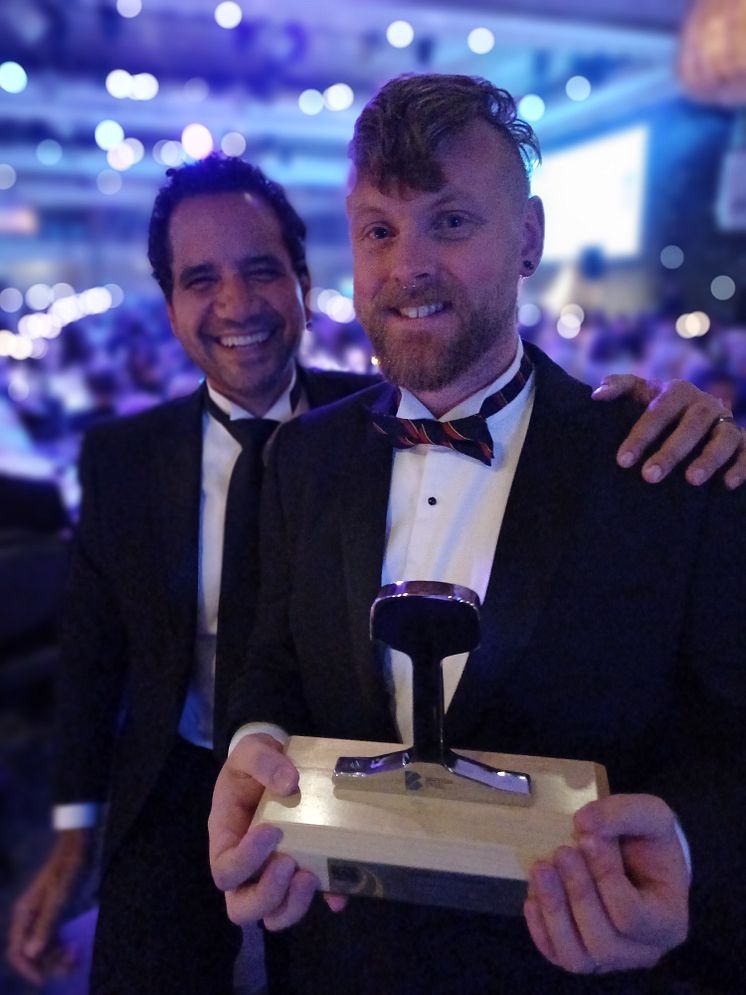 Agamemnon Otero and Jason Brooker hold their award.jpg