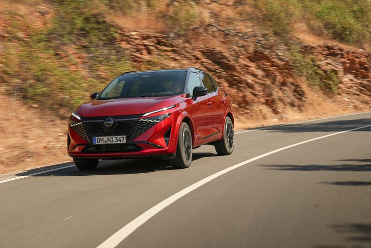 11. New refreshed Qashqai 2024 in fuji sunset color driving on the road in Faro, Portugal.jpg