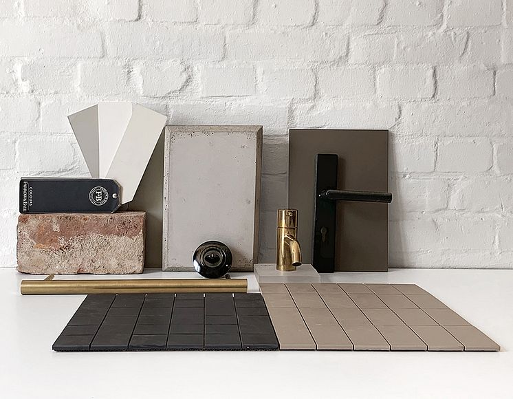 Materialcollage der Architekten mit Kupfer, Ziegel, Beton und der Schalterserie Berker Serie 1930