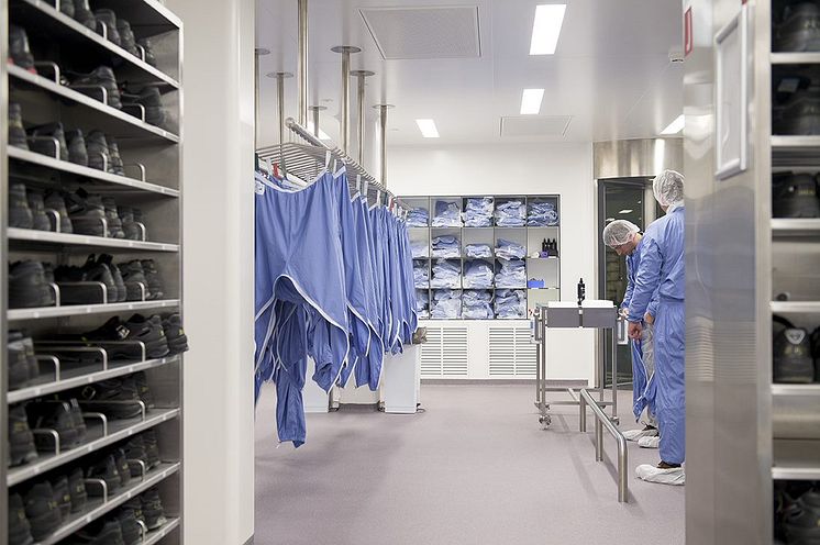 Pfizer scientists in scrubs