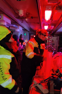 Processing water samples under red lights in the lab areas (Photo Rolf Gradinger)