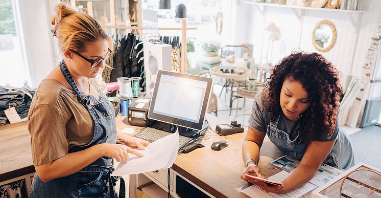 businesswomen checking shop papers SME.jpg