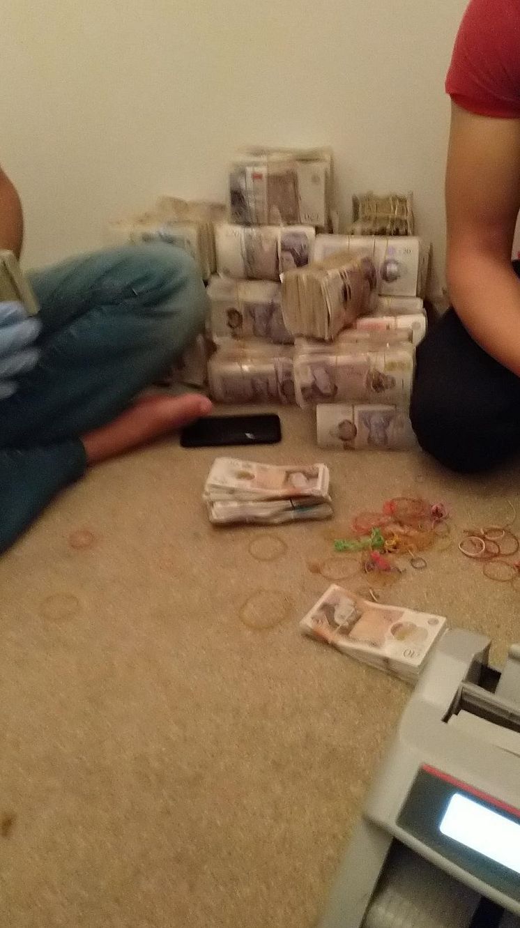 Cash being counted.jpg