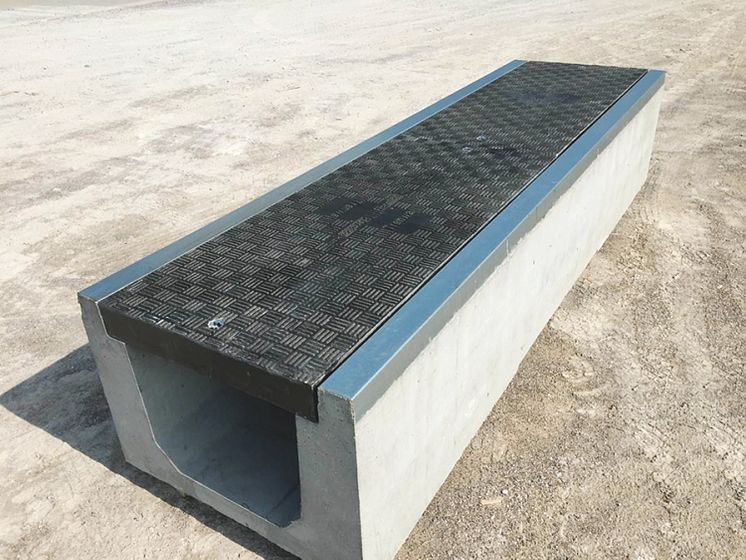 Fibrelite and Trenwa’s partnership product: heavy duty precast concrete trenches topped with light strong composite covers