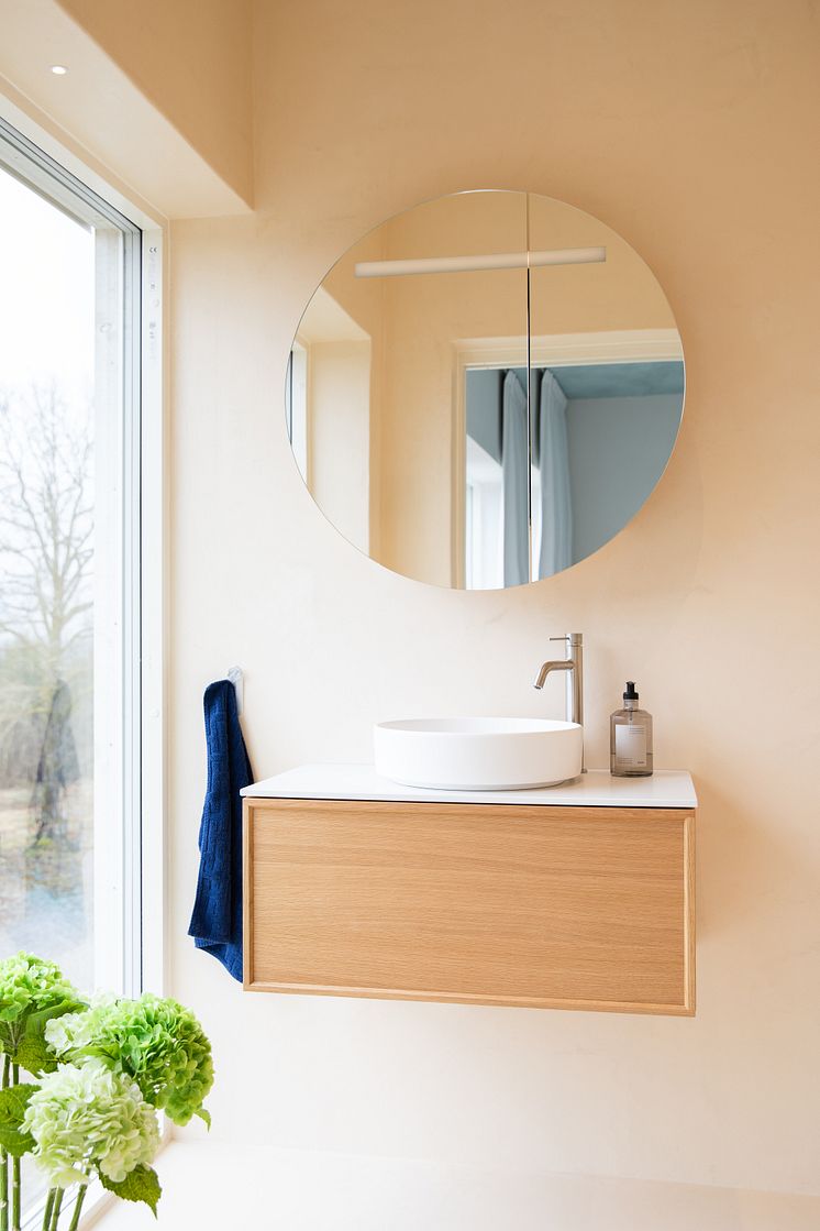 air wood vanity and circ mirror cabinet