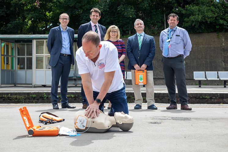 Steve Morris demonstrates heart restarter at Lewes station