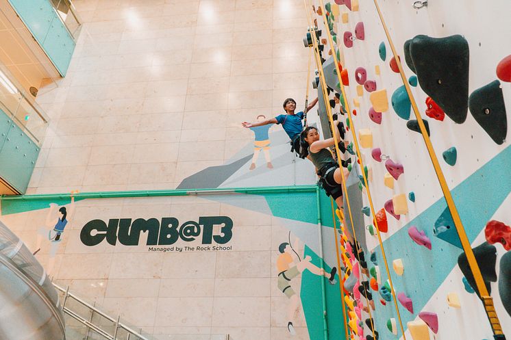 Two climbers scale the 8-metre-high High Wall at Climb@T3, which opens 4 March 2023