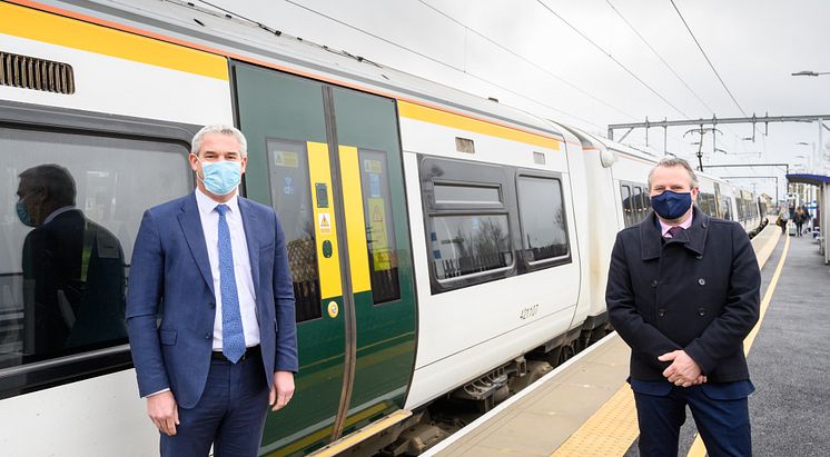 Stephen Barclay MP (left) with Govia Thameslink Railway's Infrastructure Director Keith Jipps and the preview 8-carriage train at Littleport