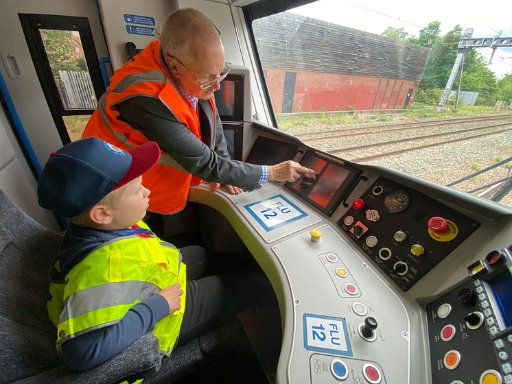 Driver manager Barry Minall shows Alfie the ropes.jpeg