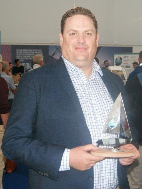 Hi-res image - Ocean Signal - Ocean Signal Sales and Marketing Manager James Hewitt with the Sailing Today Award for Gear Innovation for the rescueME MOB1