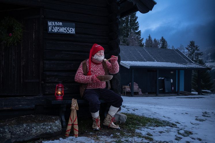 Fjøsnisse -  A Nisse eating Christmas porridge - Photo - Visit Norway - Bastian Fjeld