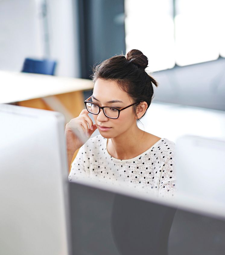 Girl with glasses working on the computer