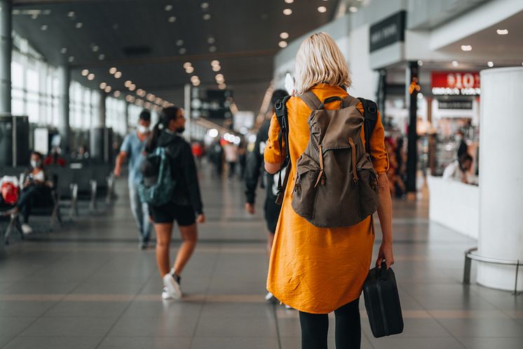 THEME_TRAVEL_AIRPORT_PEOPLE_SOLO_TRAVELER_HEADING_TO_A_FLIGHT_GATE_LUGGAGE_GettyImages-1394456702_Universal_Within usage period_99794