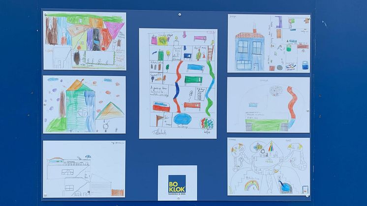 Designs from the pupils at Christ the King Catholic Primary School on the hoarding to the development BoKlok on the Brook in Bristol.