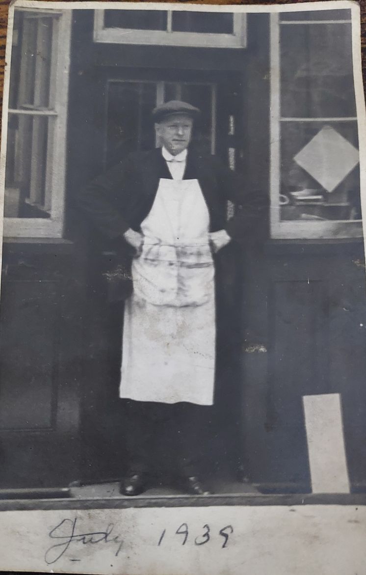 Douglas David Johnson, Eileen's father, outside the workshop in 1939.jpg
