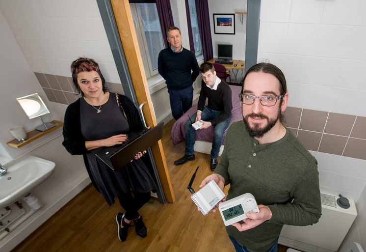 From l-r: Dr Kay Rogage (Northumbria University), Mark Riley (Your Homes Newcastle), Graham Coulby (BIM Academy) and Dr Adrian Clear (Northumbria University), pictured with the smart sensors used in the Smart Connected Buildings project.