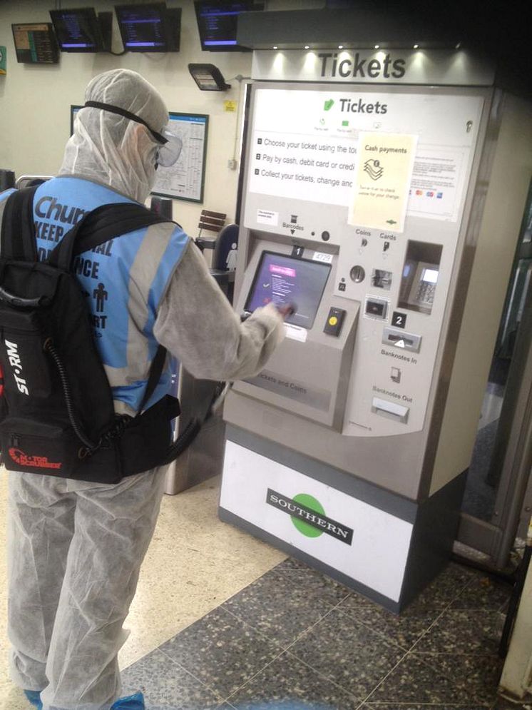 Worthing station, inside: Applying the 30-day viruscide