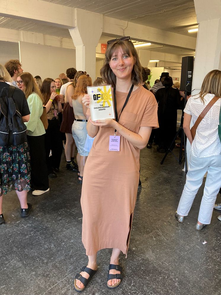 Rebecca Frost with her Graduate Fashion Week Childrenswear Award