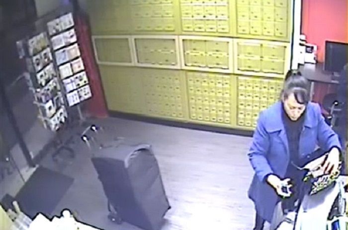 CCTV of Xiou Yu Lin collecting cigarettes LON 04 18