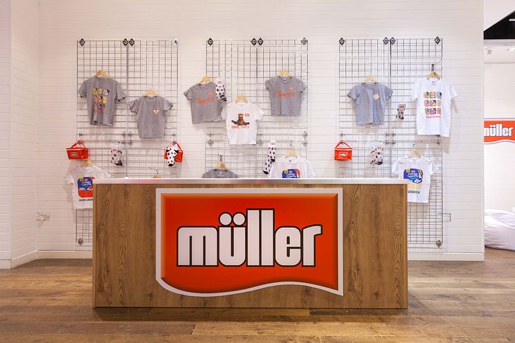 Merchandise stand at the Müller Corner Shop 
