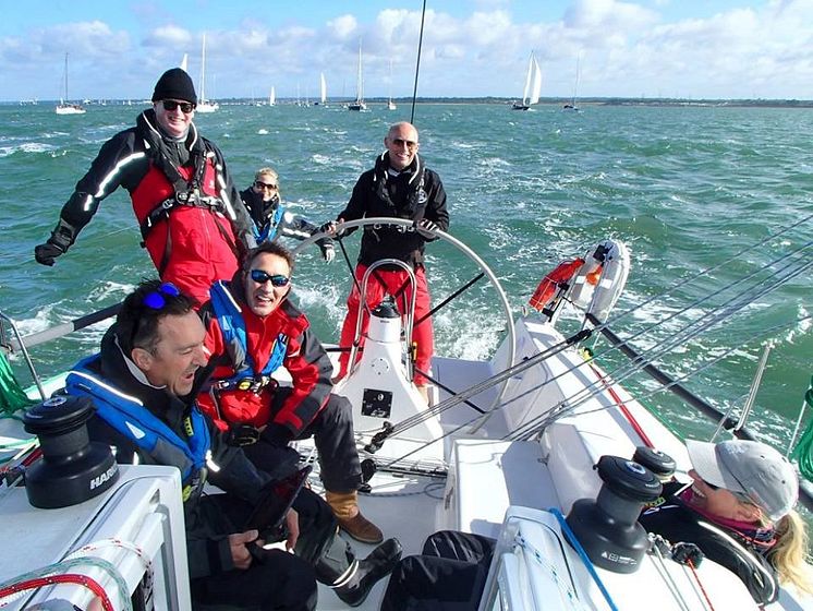Story image - Ocean Signal - Sailor Simon Grier-Jones, pictured at the helm on another occasion, fell overboard while sailing in the Solent and was successfully recovered following the activation of his Ocean Signal rescueME MOB1