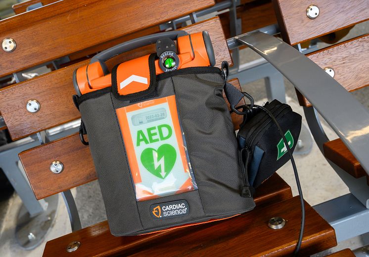 Defibrillators at every station - close up of defibrillator on station bench