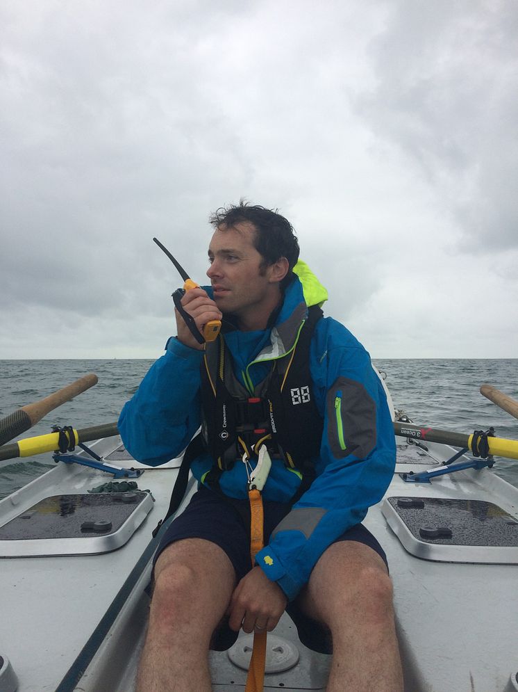 Hi-res image - Ocean Signal - Kyle Smith from Talisker Whisky Atlantic Challenge team Carbon Zerow with his Ocean Signal SafeSea V100 VHF handheld radio 