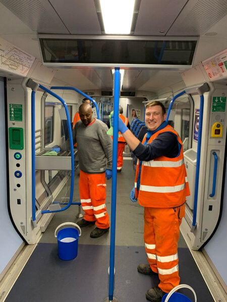 Cleaners applying the long-lasting viruscide to trains at Bedford 24 April
