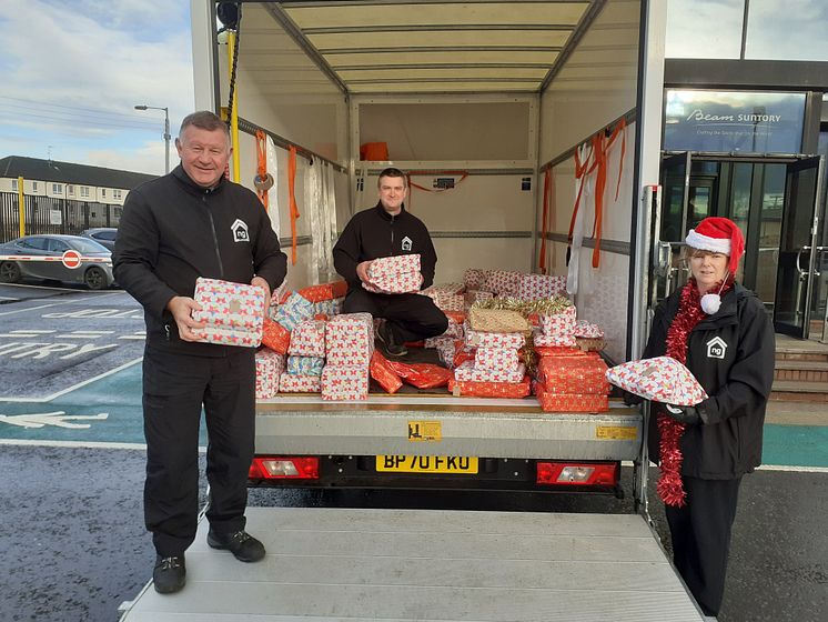 ng homes Regeneration staff Dom, Ronnie and Paula distributing gifts from.jpg
