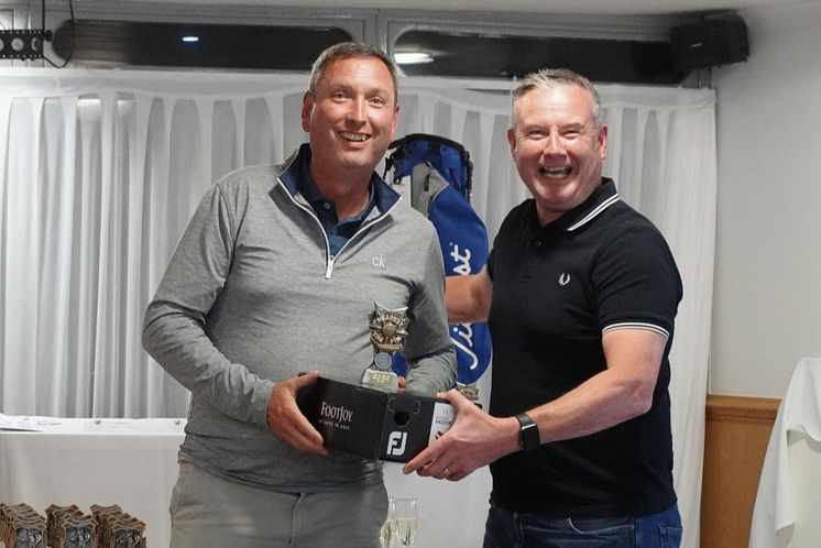 Dougie Brown of FES Group won nearest to the pin on 3rd presented by Paul Cassin from Vent Axia